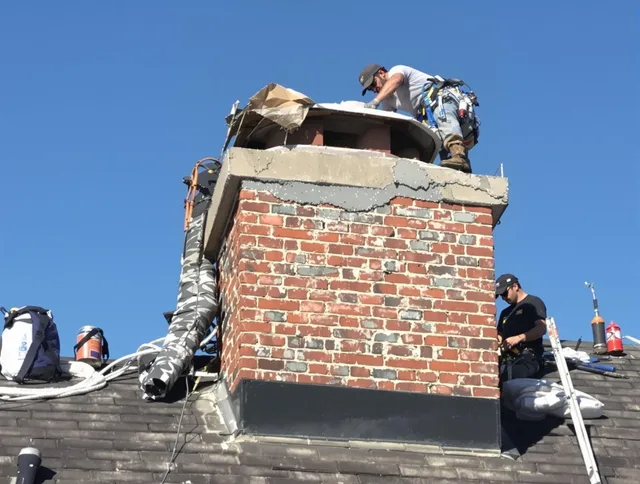 Chino Chimney Sweep installing a custom chimney crown in Chino, CA