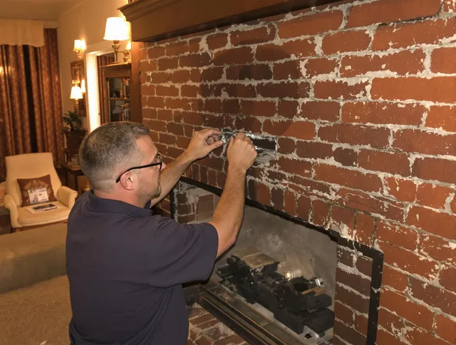 Chino Chimney Sweep expert fixing a fireplace in Chino, CA